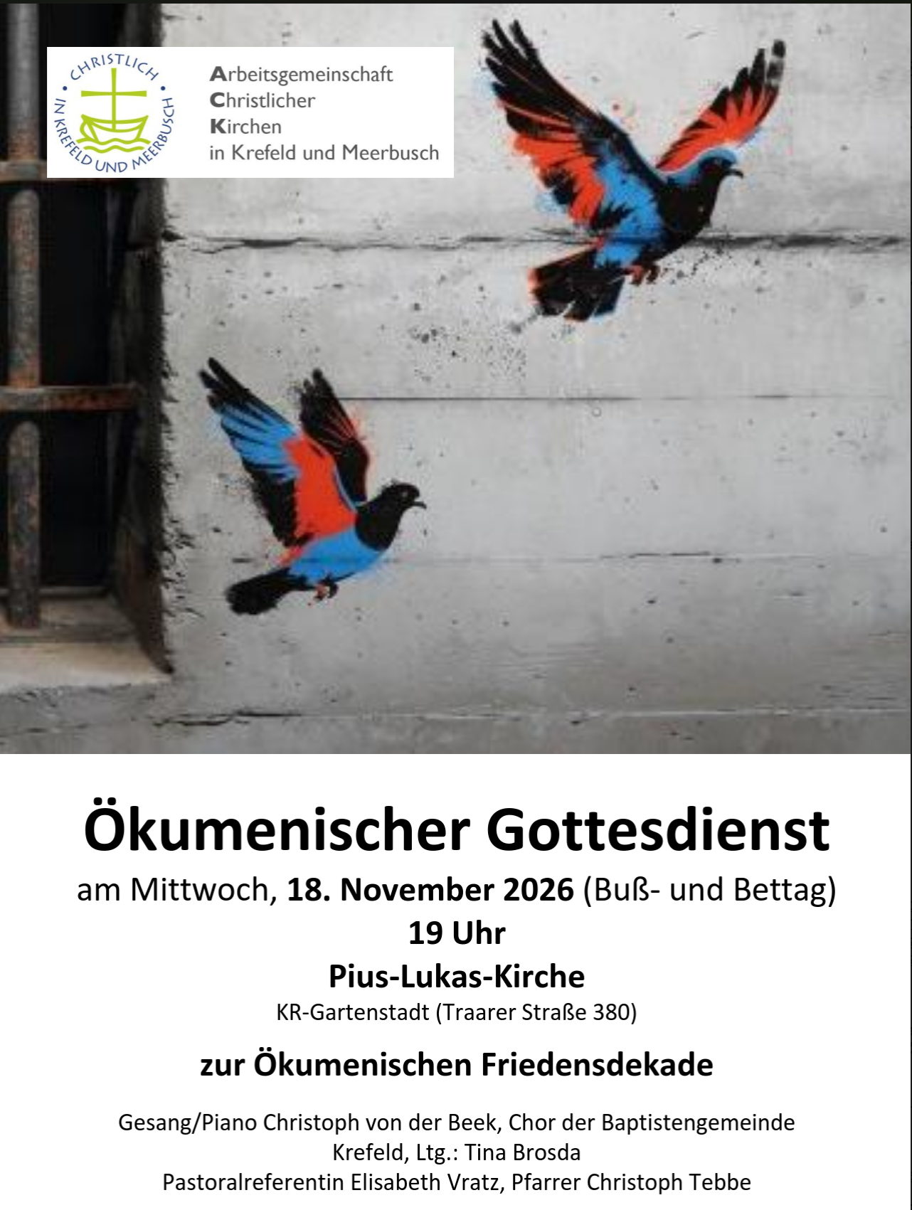 Es sind zwei bunte Taugen auf einer Wand gemalt, die offenbar zu einem Gefängnis geört.